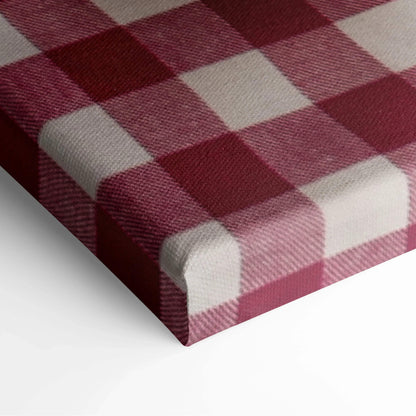 Close-up of canvas corner with burgundy and white gingham pattern on textured fabric wall art panel.