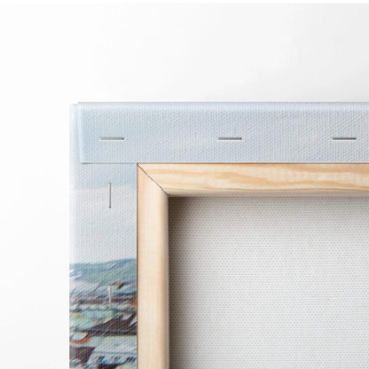 Close-up of stretched white canvas on wooden frame with staples securing fabric for wall art display.