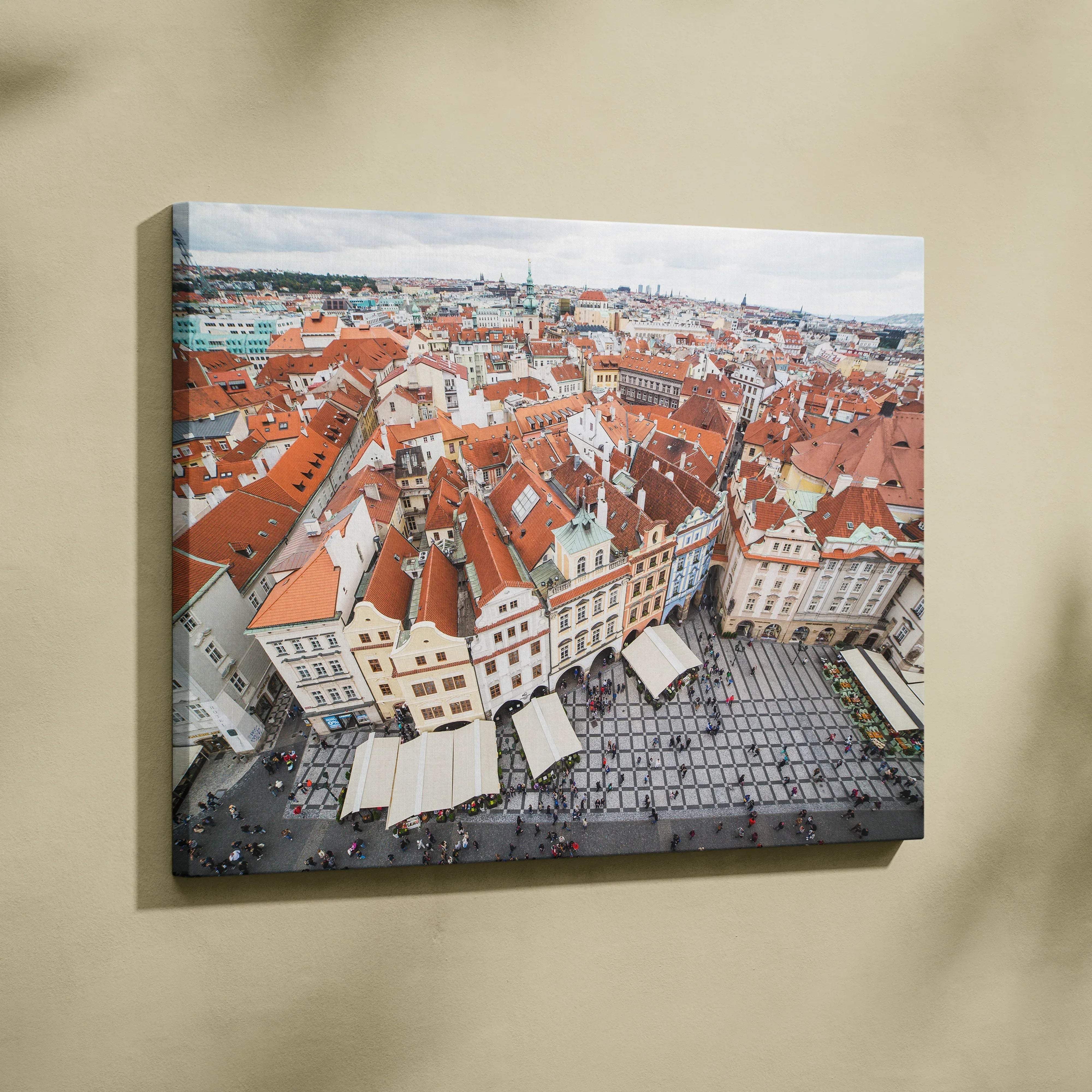 Canvas wall art featuring aerial view of red-roofed buildings in a historic city square.