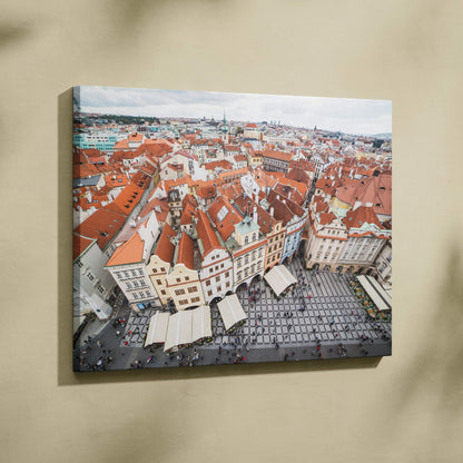Canvas wall art featuring aerial view of red-roofed buildings in a historic city square.