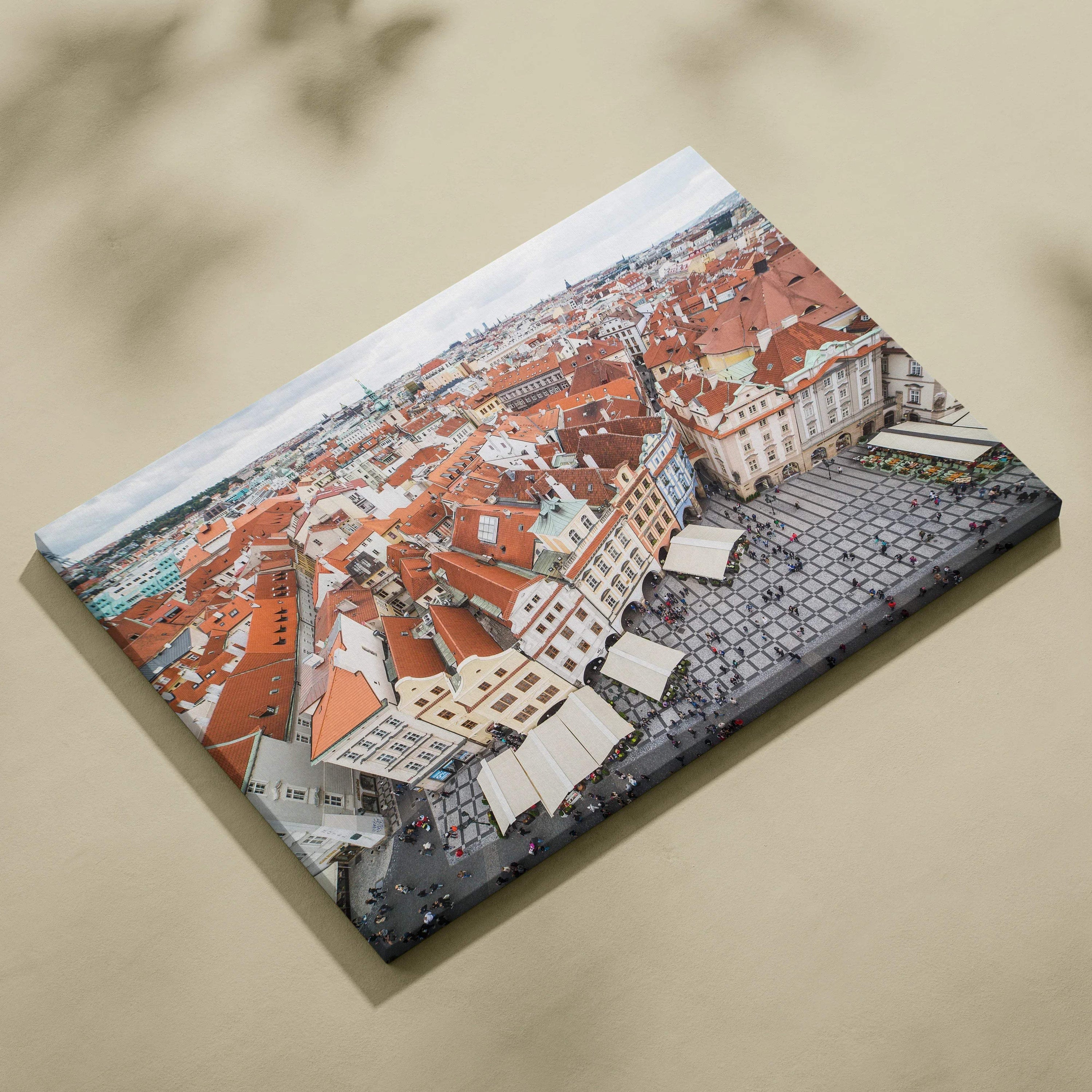 Canvas wall art featuring a detailed aerial view of red-roofed buildings and cobblestone streets in a historic cityscape.