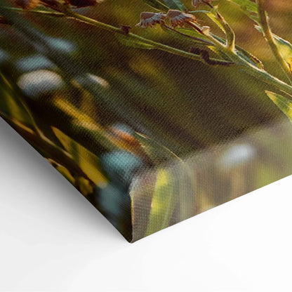 Canvas wall art featuring detailed close-up of cherry blossom branches with soft pink flowers and green leaves against a.