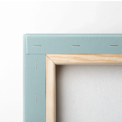 Close-up of canvas edge with light blue painted sides and natural wood stretcher bars on wall art canvas.