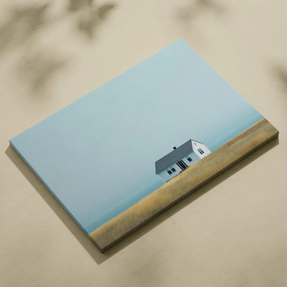 Canvas wall art featuring a minimalist modern house against a clear blue sky and golden field background.