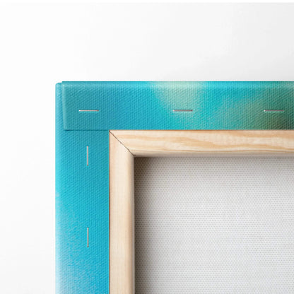 Close-up of a canvas stretcher bar with turquoise painted fabric and natural wood frame for wall art decor.