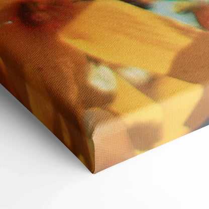Close-up of premium canvas wall art showing textured floral cherry blossom design in warm yellow and orange tones for home.