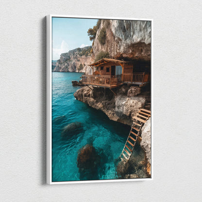 Vertical canvas art of rustic wooden house on rocky cliff above clear blue sea wall art for home decor.