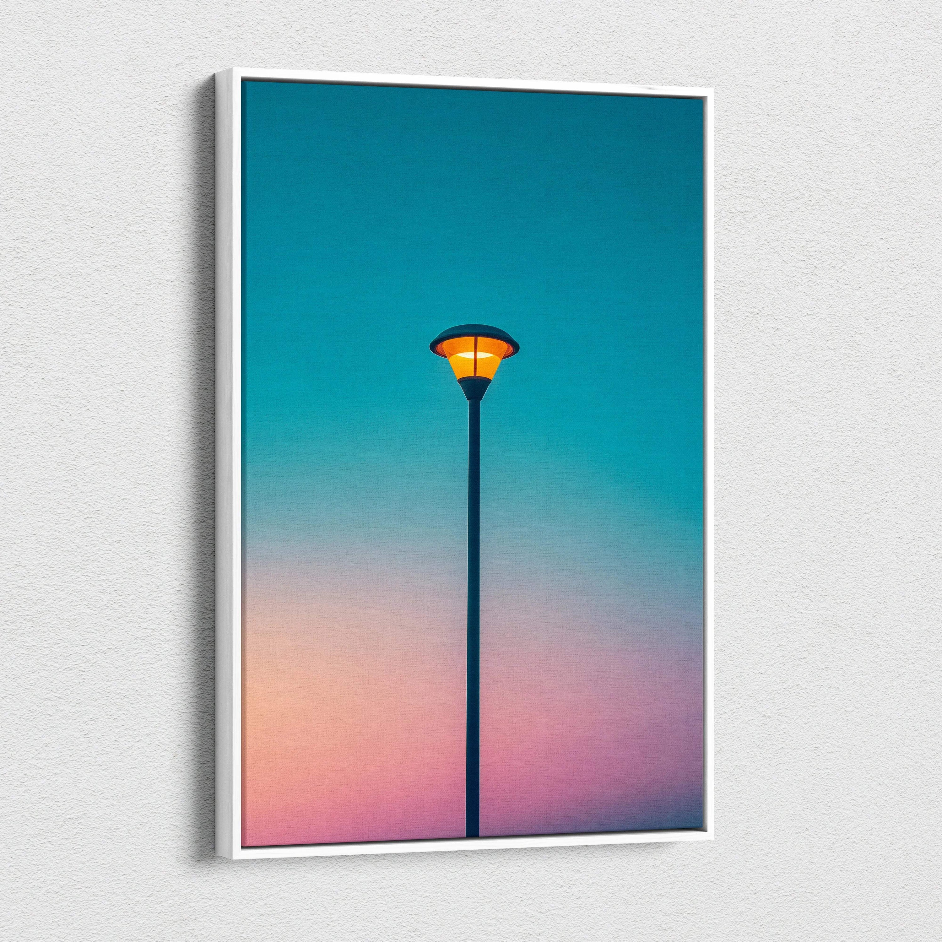 Framed canvas print of solitary streetlamp with orange glow on teal to peach sky