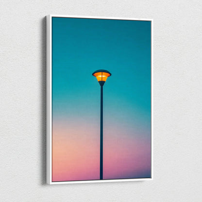 Framed canvas print of solitary streetlamp with orange glow on teal to peach sky