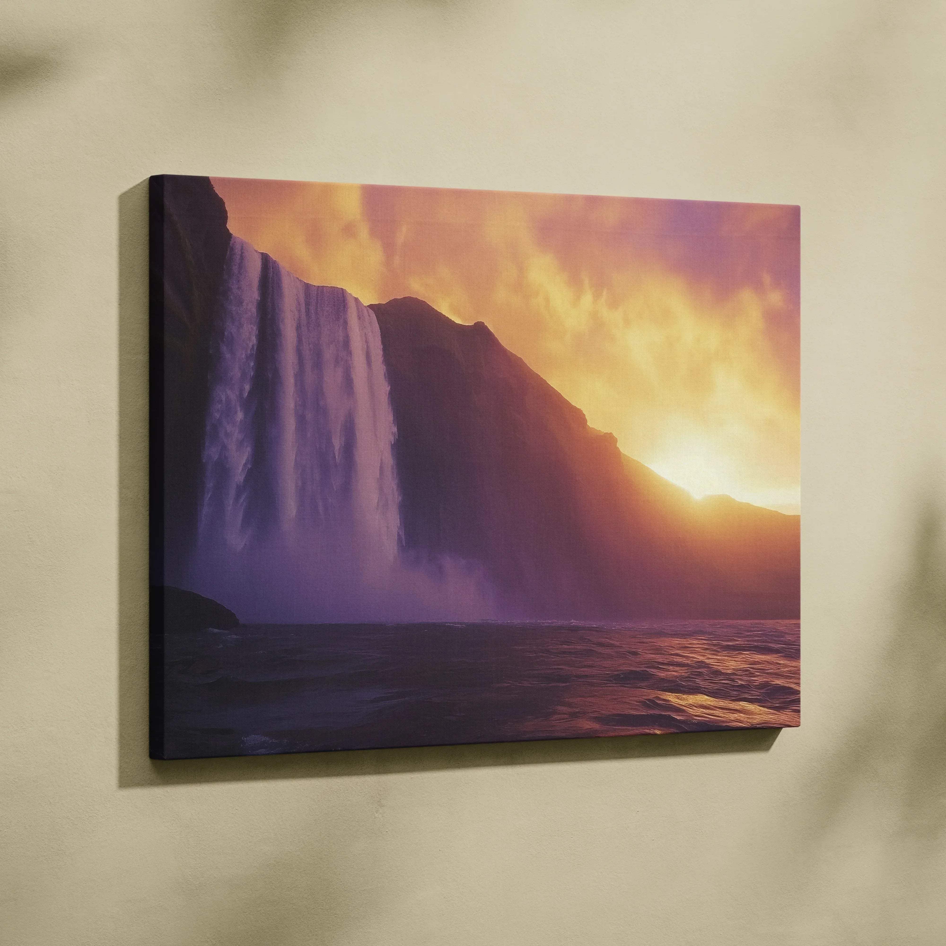 A vibrant large canvas print of a majestic waterfall at sunset with warm orange and purple hues wall art