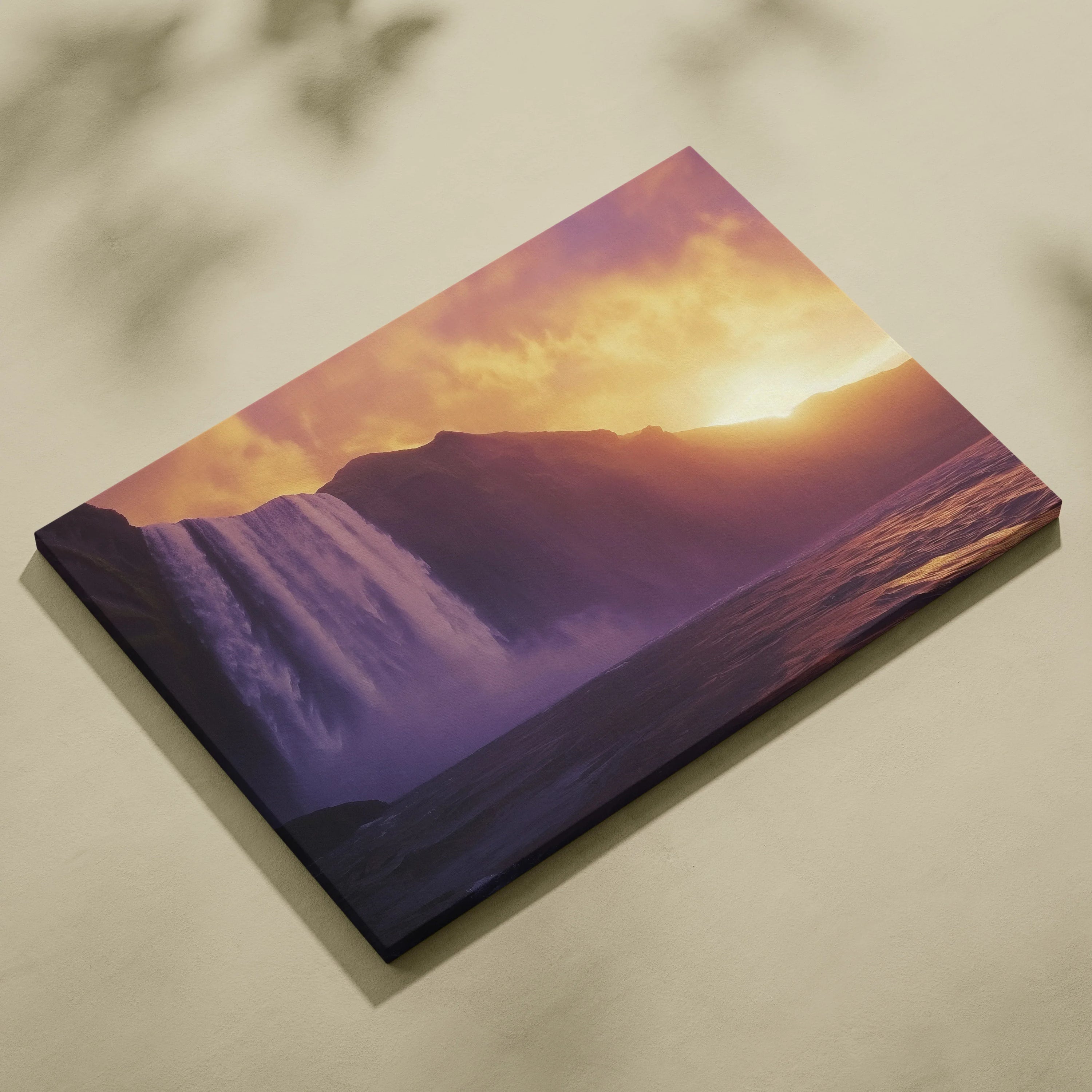 Large rectangular canvas wall art featuring a vibrant waterfall at sunset with purple and orange hues, ideal nature decor.