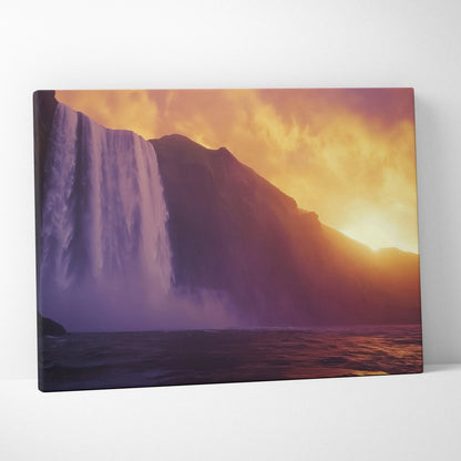 Large canvas wall art featuring a vibrant waterfall cascading down rocky cliffs at sunset with warm orange and purple tones.