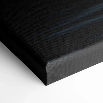 Close-up of black textured abstract canvas art with subtle blue streaks, modern wall art canvas print.