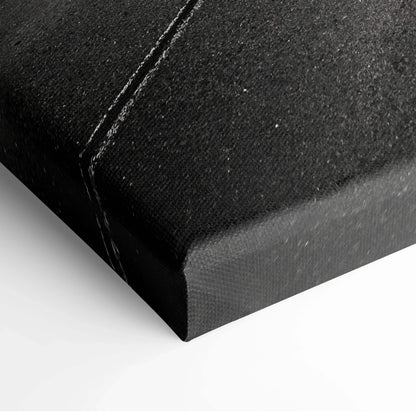 Black textured canvas corner with visible stitching, modern wall art decor detail.
