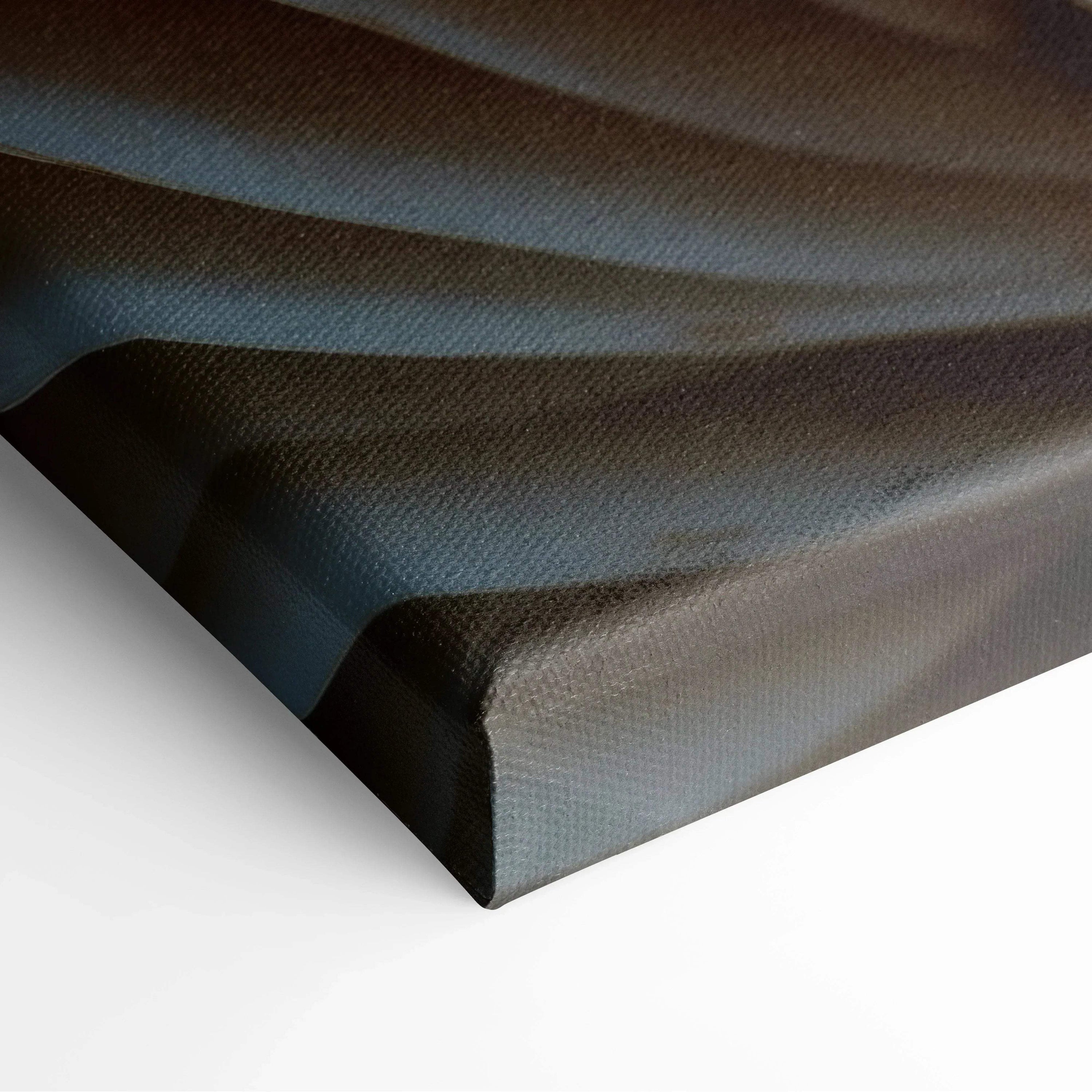 Close-up of textured canvas corner with layered shades of muted blue and gray, highlighting fabric detail for wall art decor.