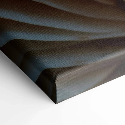 Close-up of textured canvas corner with layered shades of muted blue and gray, highlighting fabric detail for wall art decor.