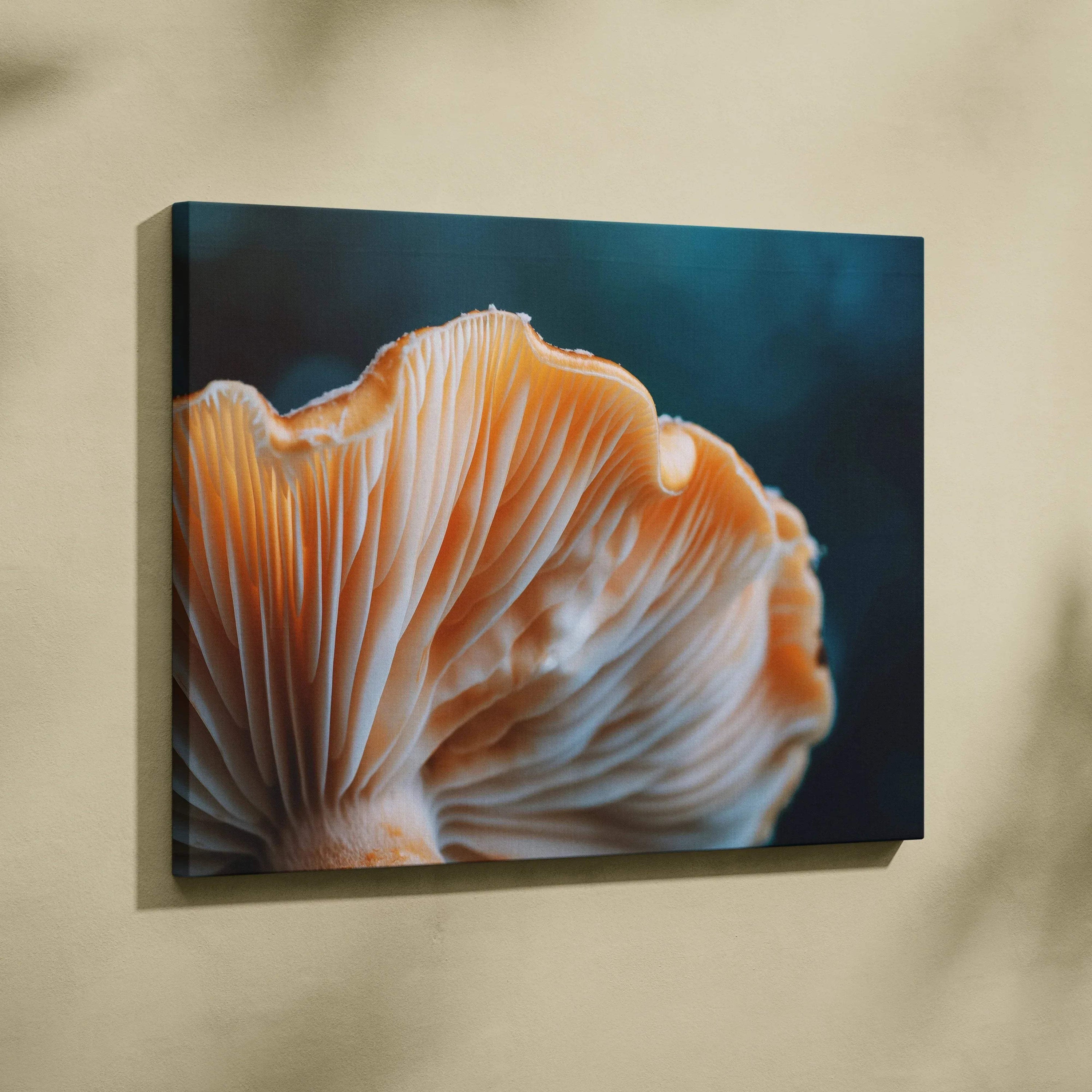 Canvas wall art featuring a close-up of a vibrant orange mushroom with detailed gills against a deep blue background.