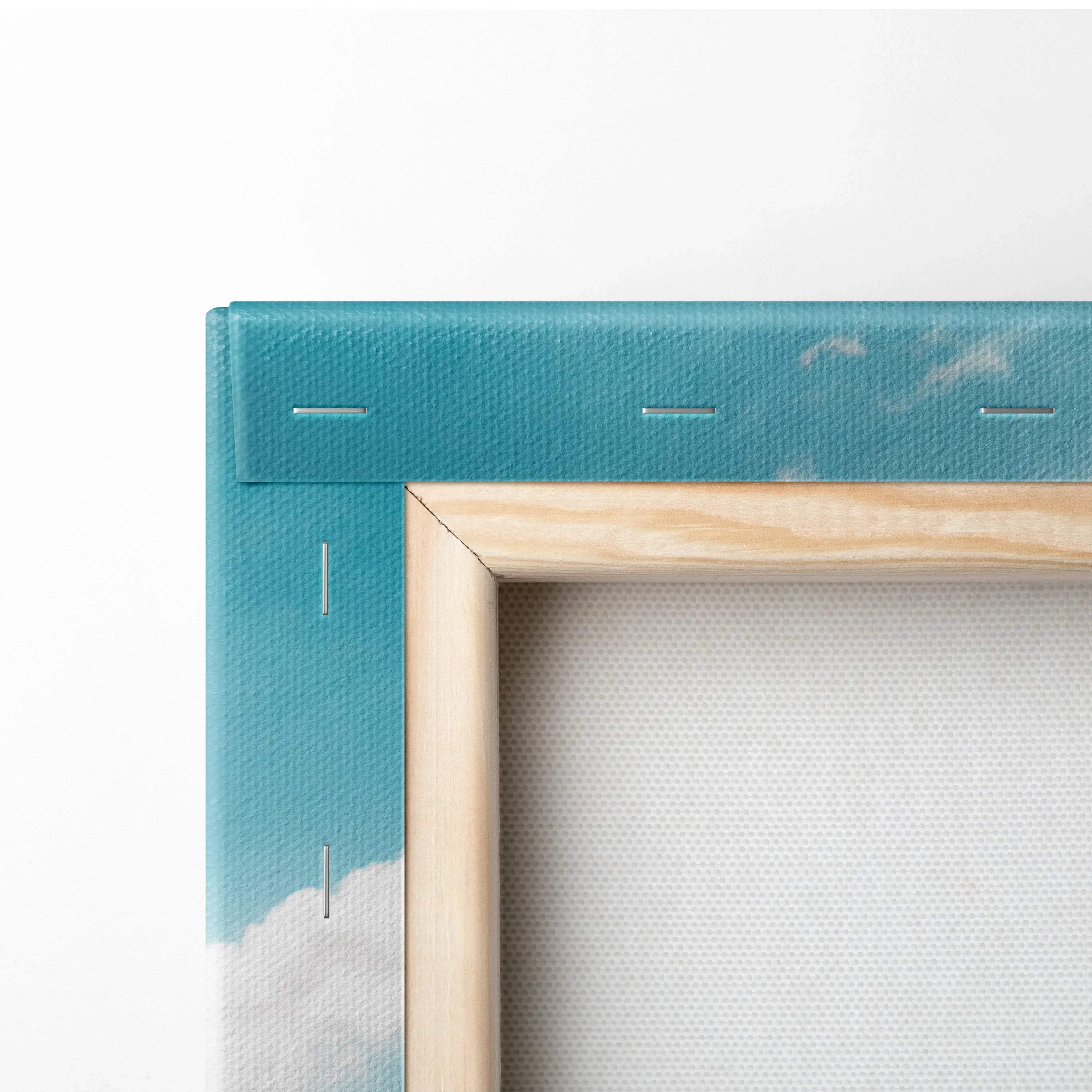 Close-up of wooden stretcher frame with sky-blue canvas and visible staples for wall art display.