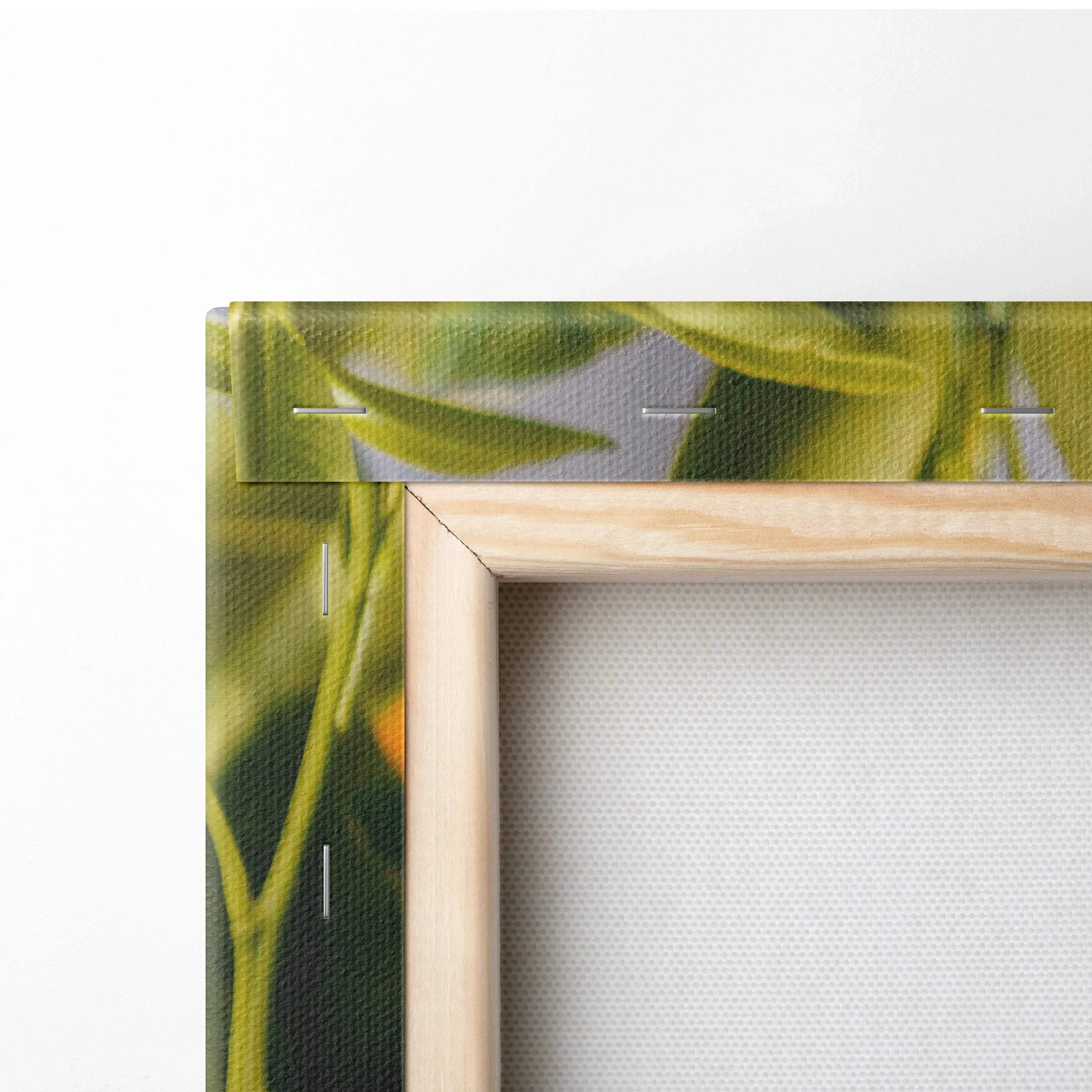 Close-up of wooden-framed canvas with vibrant green leaves and ripe orange mandarins on fabric texture.