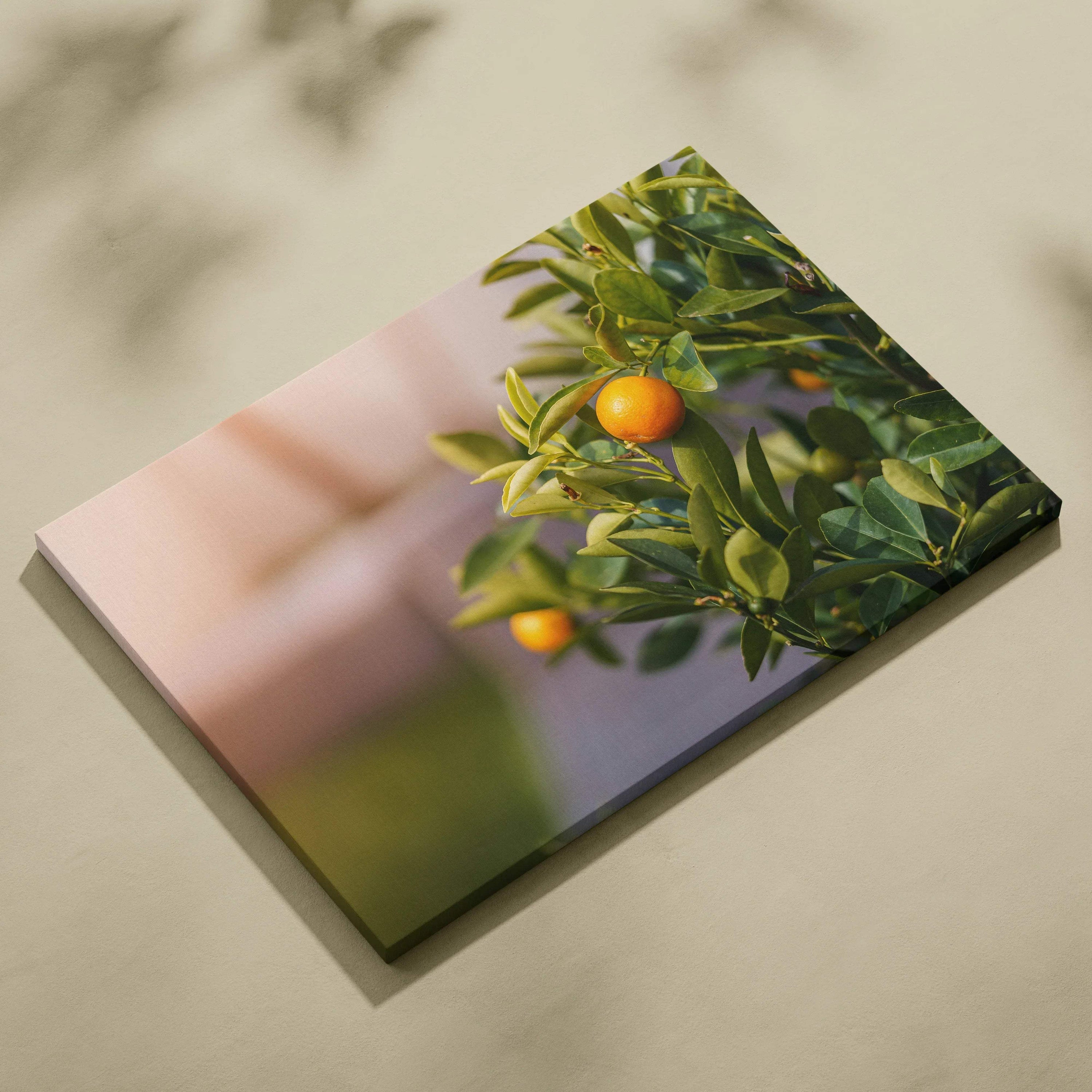 Canvas wall art featuring a vibrant mandarin tree branch with ripe orange fruits and lush green leaves against a soft.