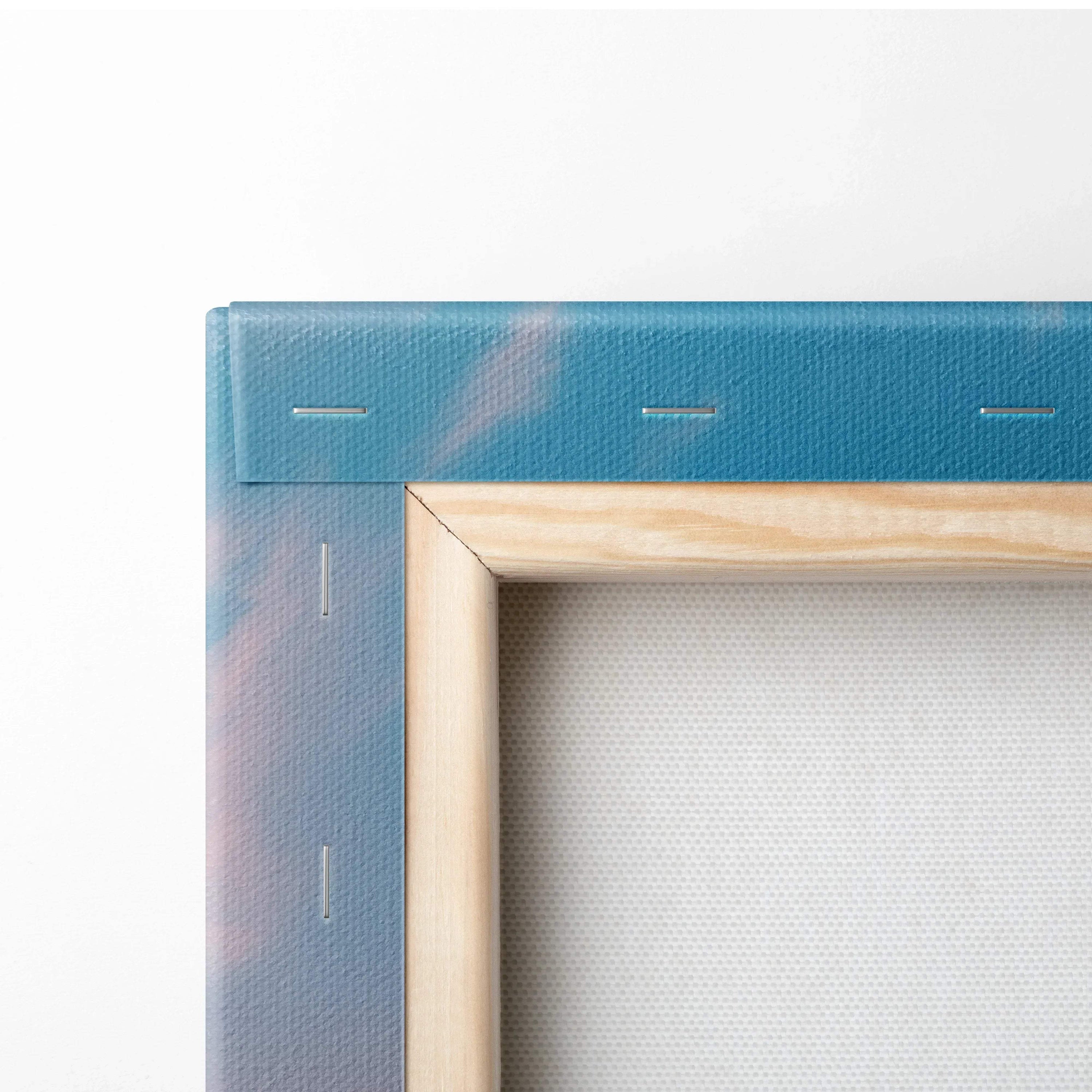 Close-up of stretched canvas art with natural wood frame and blue beach sunset print edges.