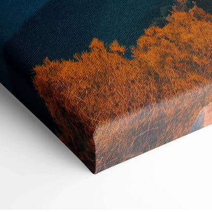 Close-up of textured canvas art featuring burnt orange and deep blue abstract patterns on a stretched canvas edge.