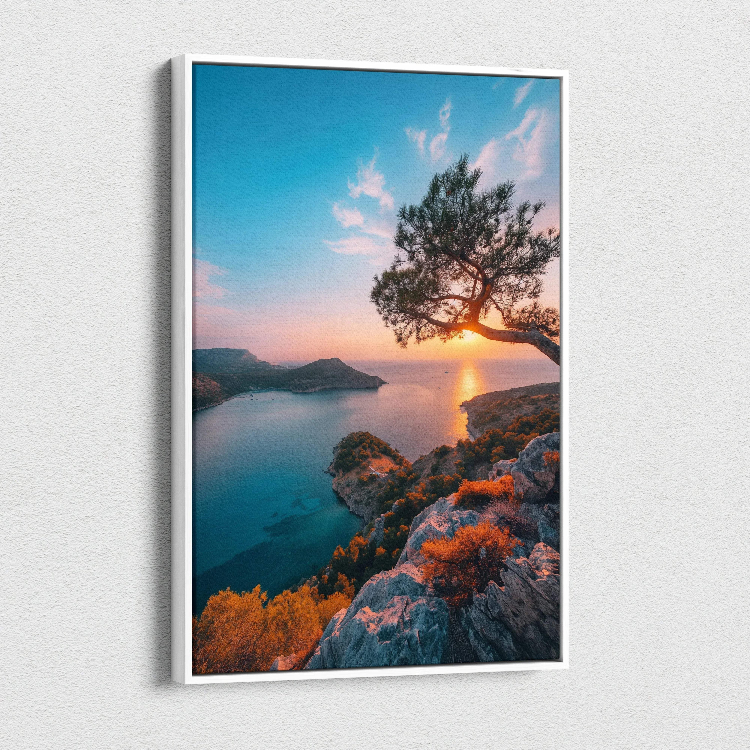 Sunset beach scene canvas art with rocky cliff, silhouetted tree, and vibrant sky colors.