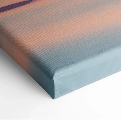 Canvas wall art with a minimalist gradient of soft peach and muted blue tones, depicting a serene sunset over the sea.