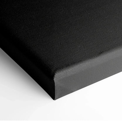Black minimalist digital art canvas print with textured fabric and sharp wrapped edges.