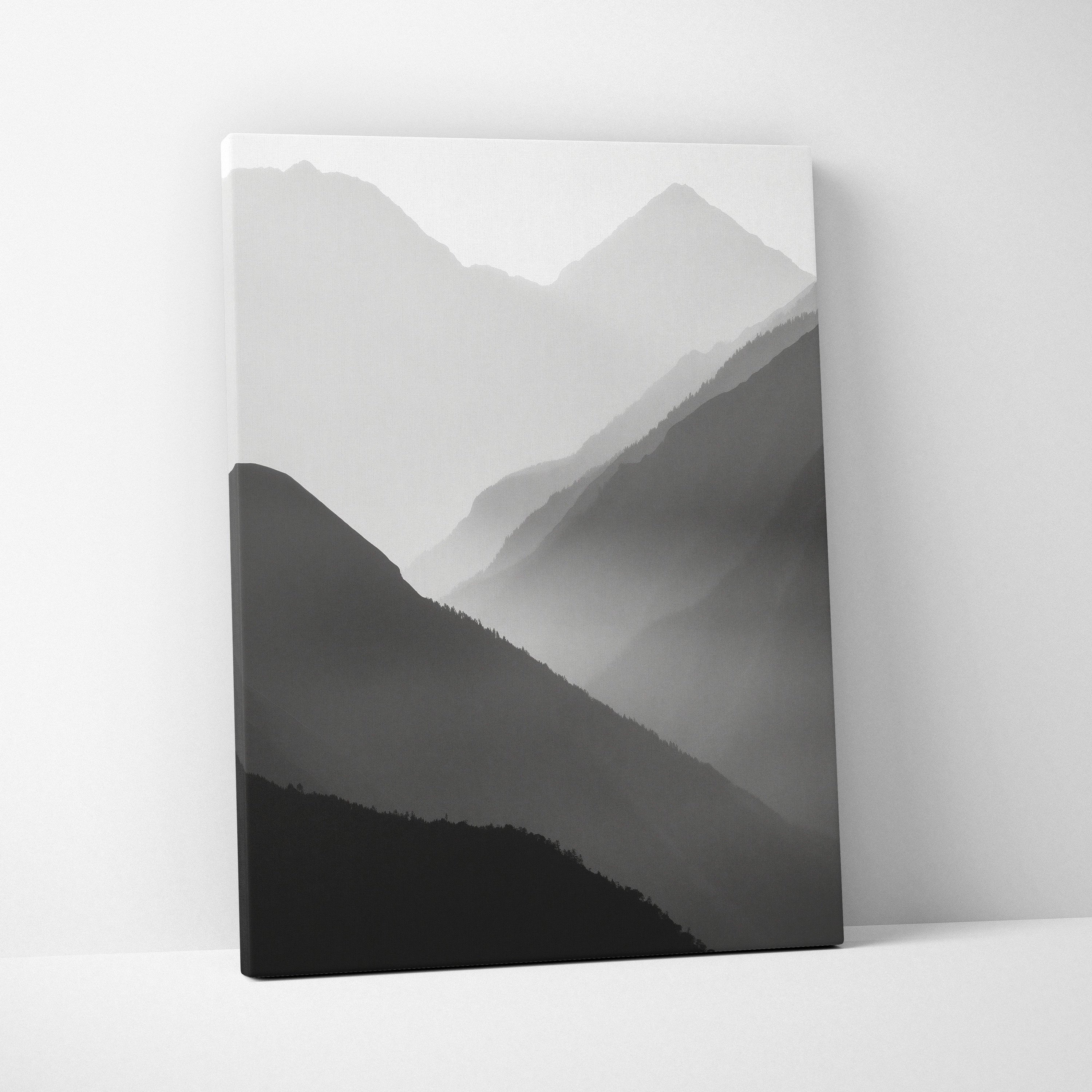 Minimalist black and gray digital art canvas print featuring layered mountain silhouettes in mist for wall decor.