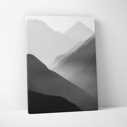 Minimalist black and gray digital art canvas print featuring layered mountain silhouettes in mist for wall decor.