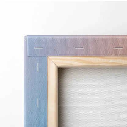 Close-up of blue edge wrapped canvas with wooden stretcher bars for wall art display.