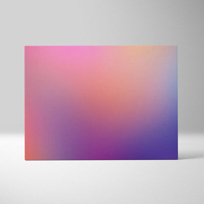 Abstract canvas art with a smooth gradient blending pink, orange, and purple tones on a rectangular wall print.