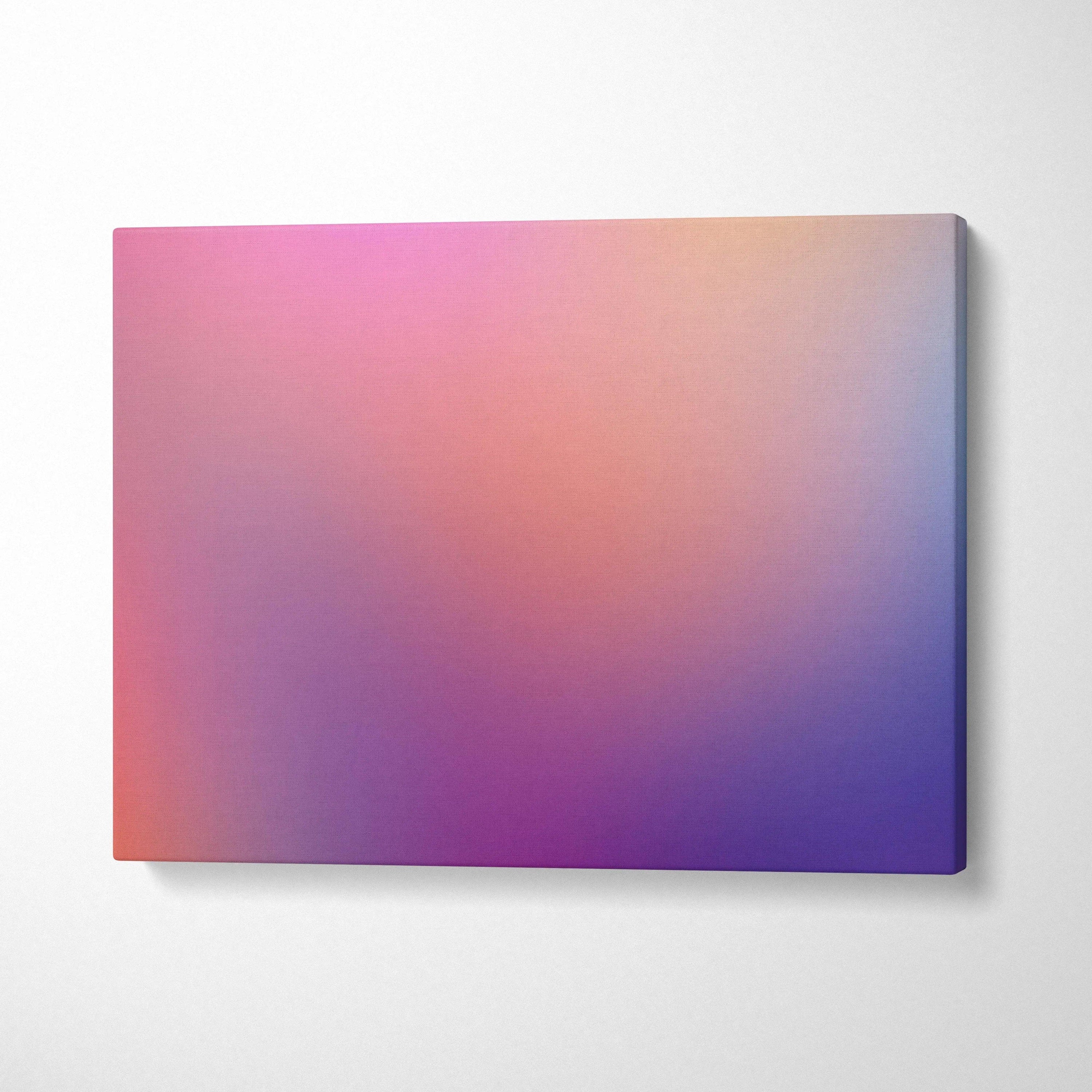 Abstract gradient canvas wall art with soft pink, orange, and purple hues on stretched canvas.