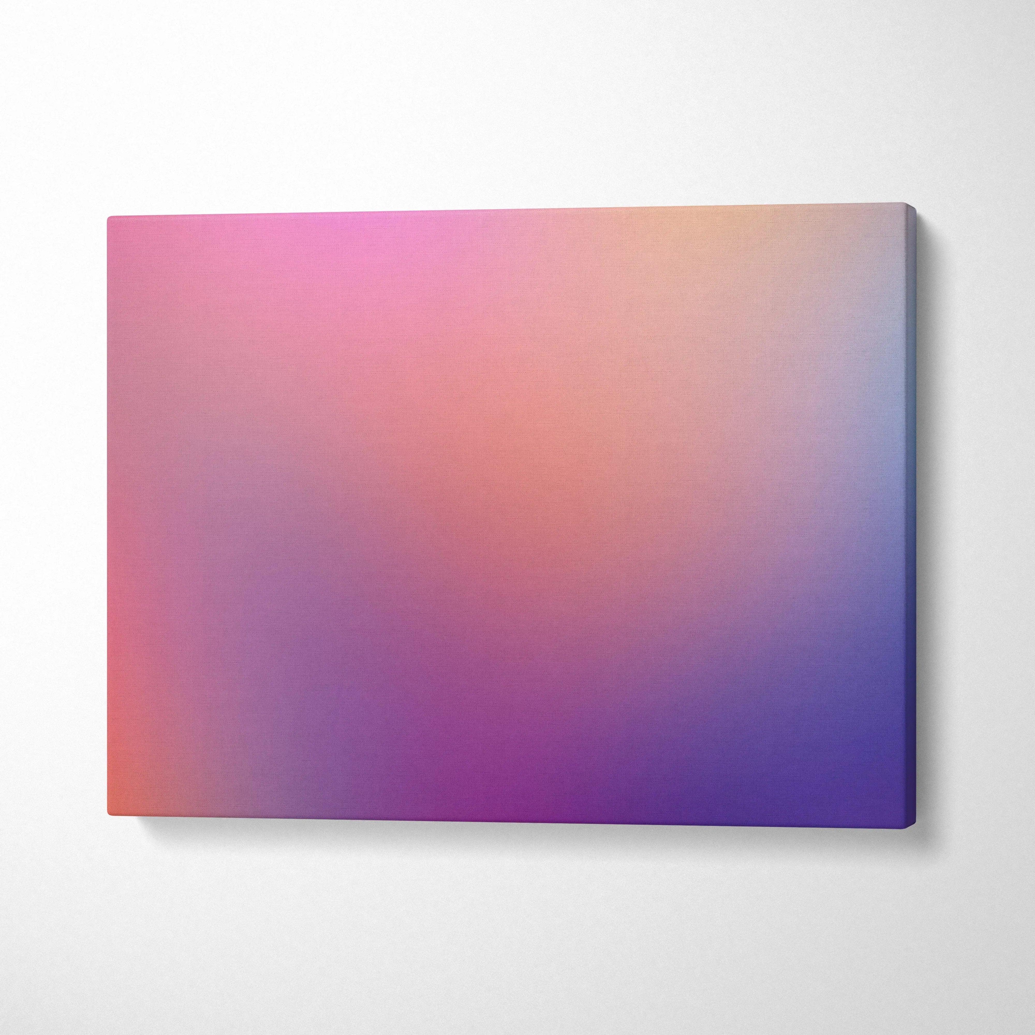 Abstract gradient canvas wall art with soft pink, orange, and purple hues on stretched canvas.