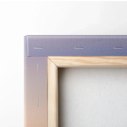 Close-up of canvas wall art corner showing tight purple fabric wrap and wooden stretcher bars.