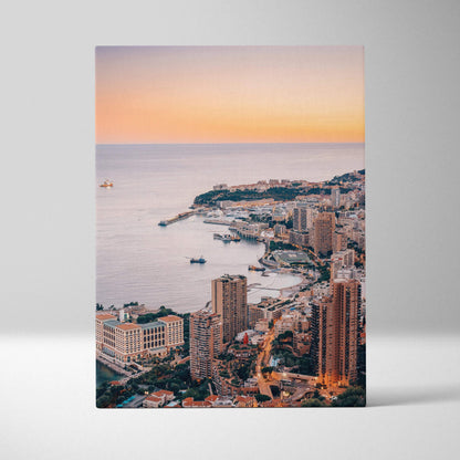 Vertical canvas wall art featuring Monaco cityscape at sunset with coastal buildings and sea view.