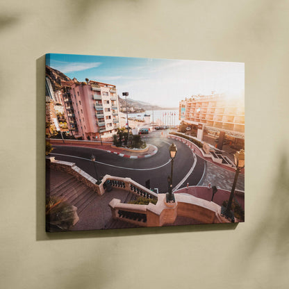 Canvas wall art featuring a sunlit aerial view of a curved Monaco F1 track hairpin with surrounding buildings and railings.