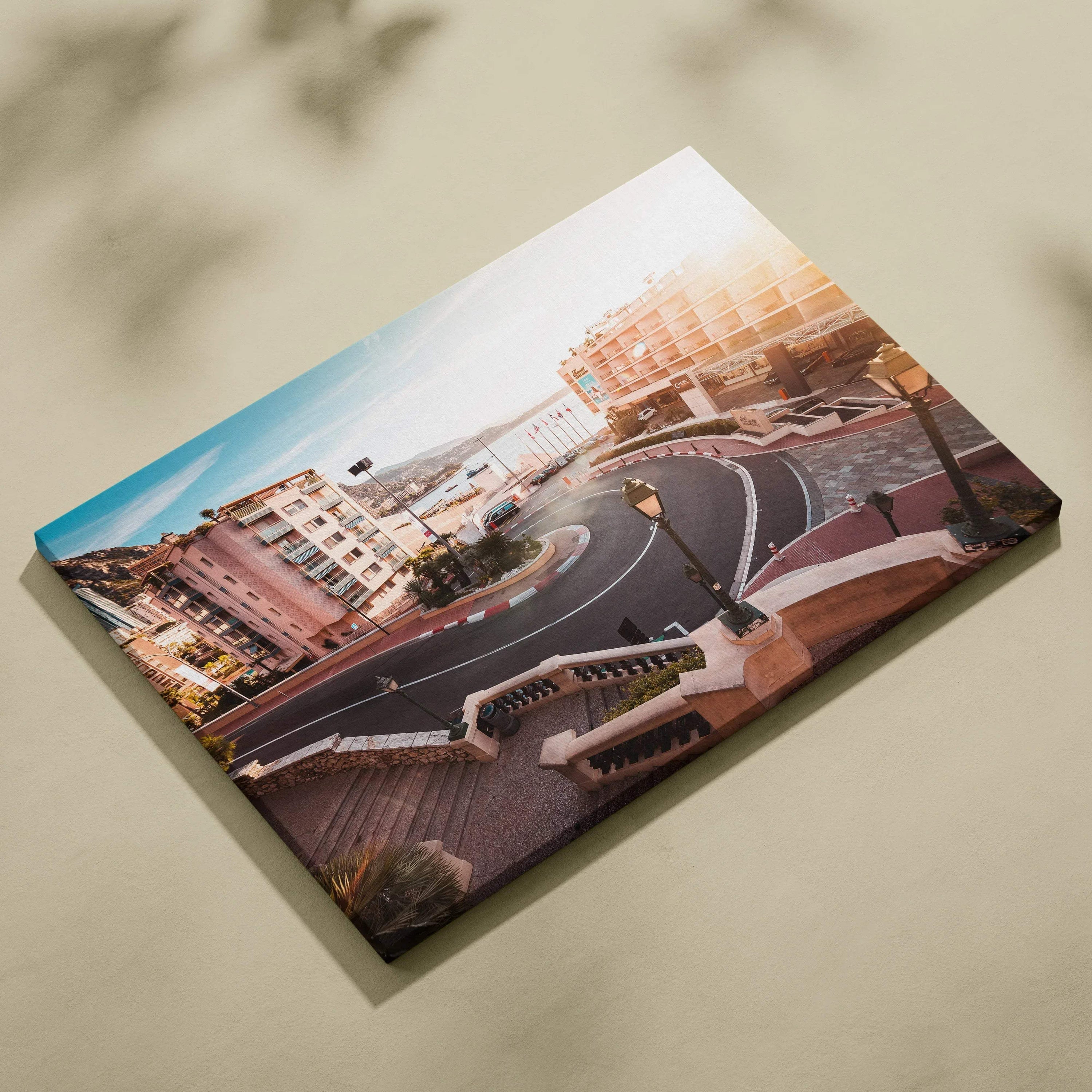Canvas wall art featuring a detailed digital view of Monaco F1 track's hairpin turn with surrounding buildings in warm.