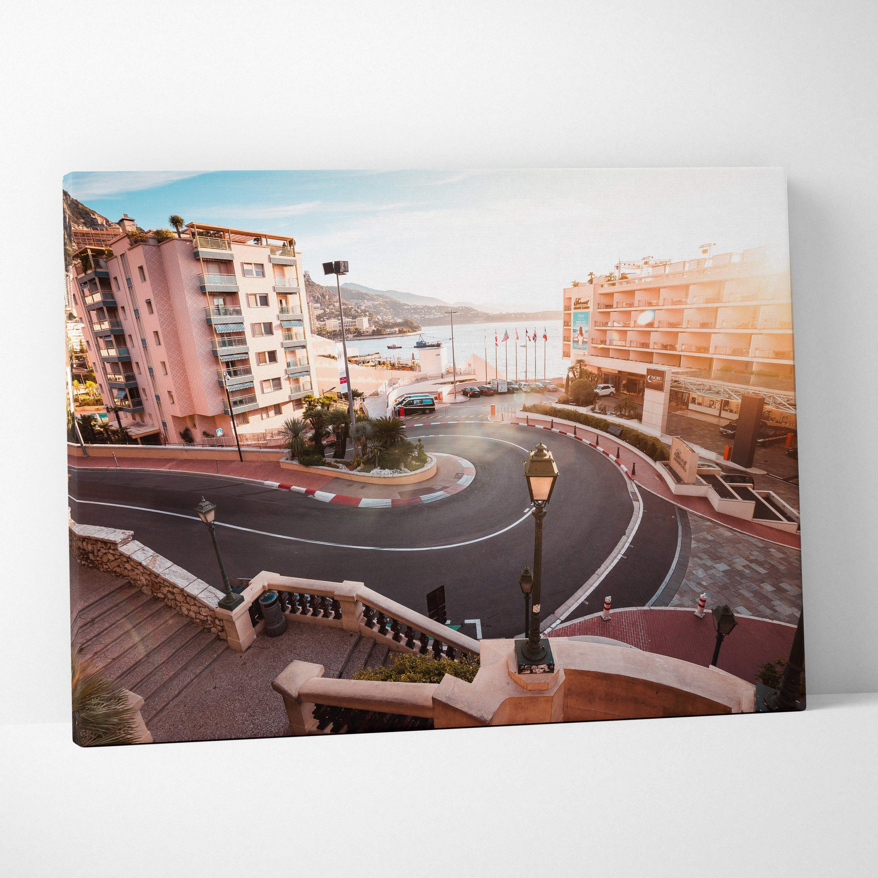 Canvas wall art featuring a sunlit Monaco F1 hairpin turn with surrounding buildings and coastal view.