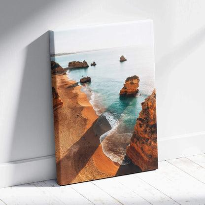Canvas wall art featuring a serene beach scene with golden cliffs and turquoise water.