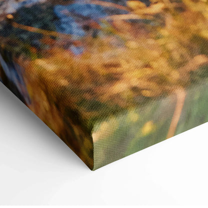 Close-up of textured canvas print corner featuring warm, blurred colors of Norwegian town architecture wall art.