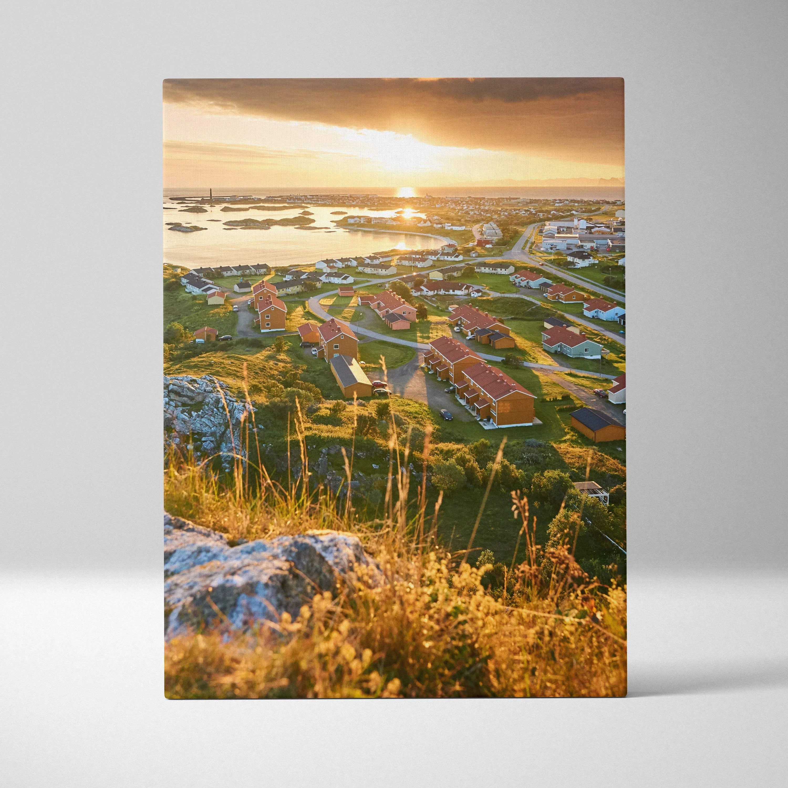Canvas wall art showing Norwegian town architecture at sunset with warm golden light.