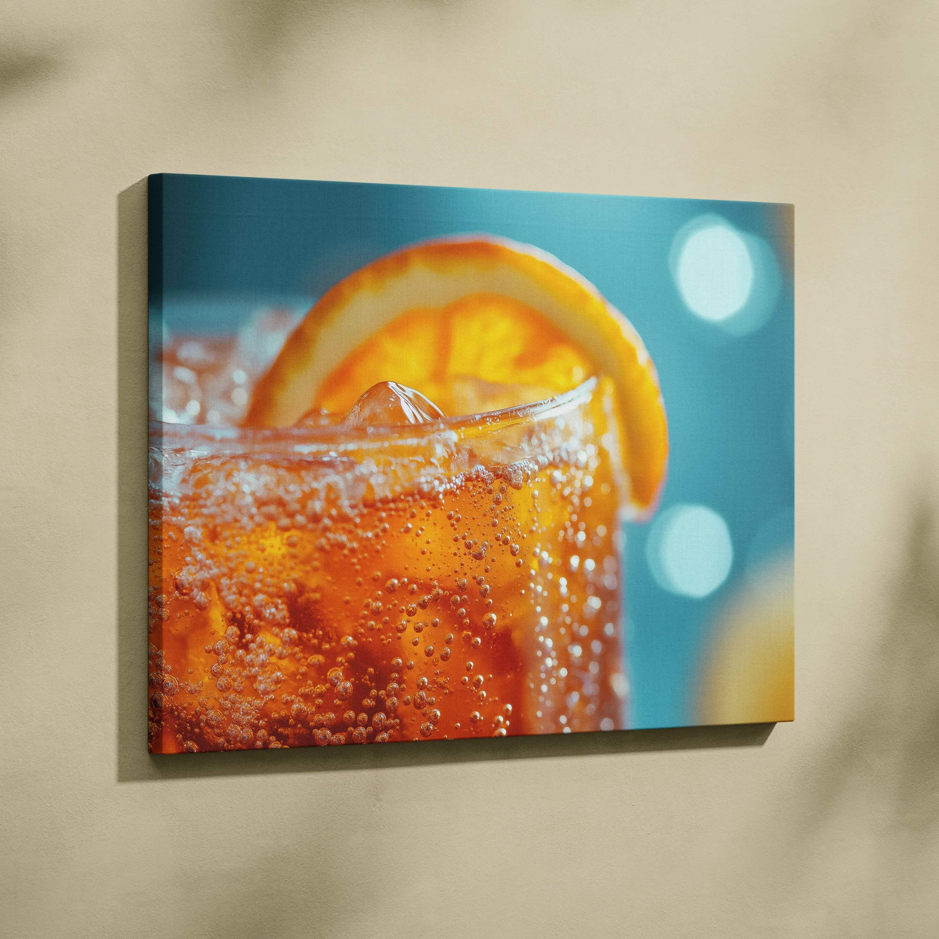 Canvas wall art featuring a close-up of a vibrant orange drink with ice and a citrus slice against a blue background.
