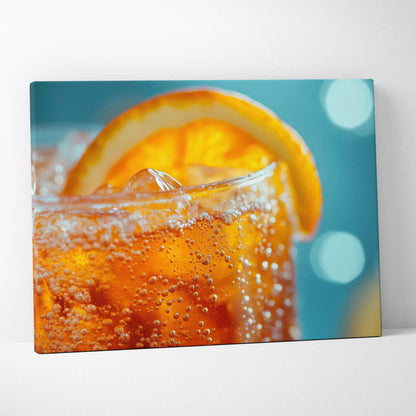 Canvas wall art featuring a close-up of a vibrant orange fizzy drink with an orange slice garnish against a blurred blue.