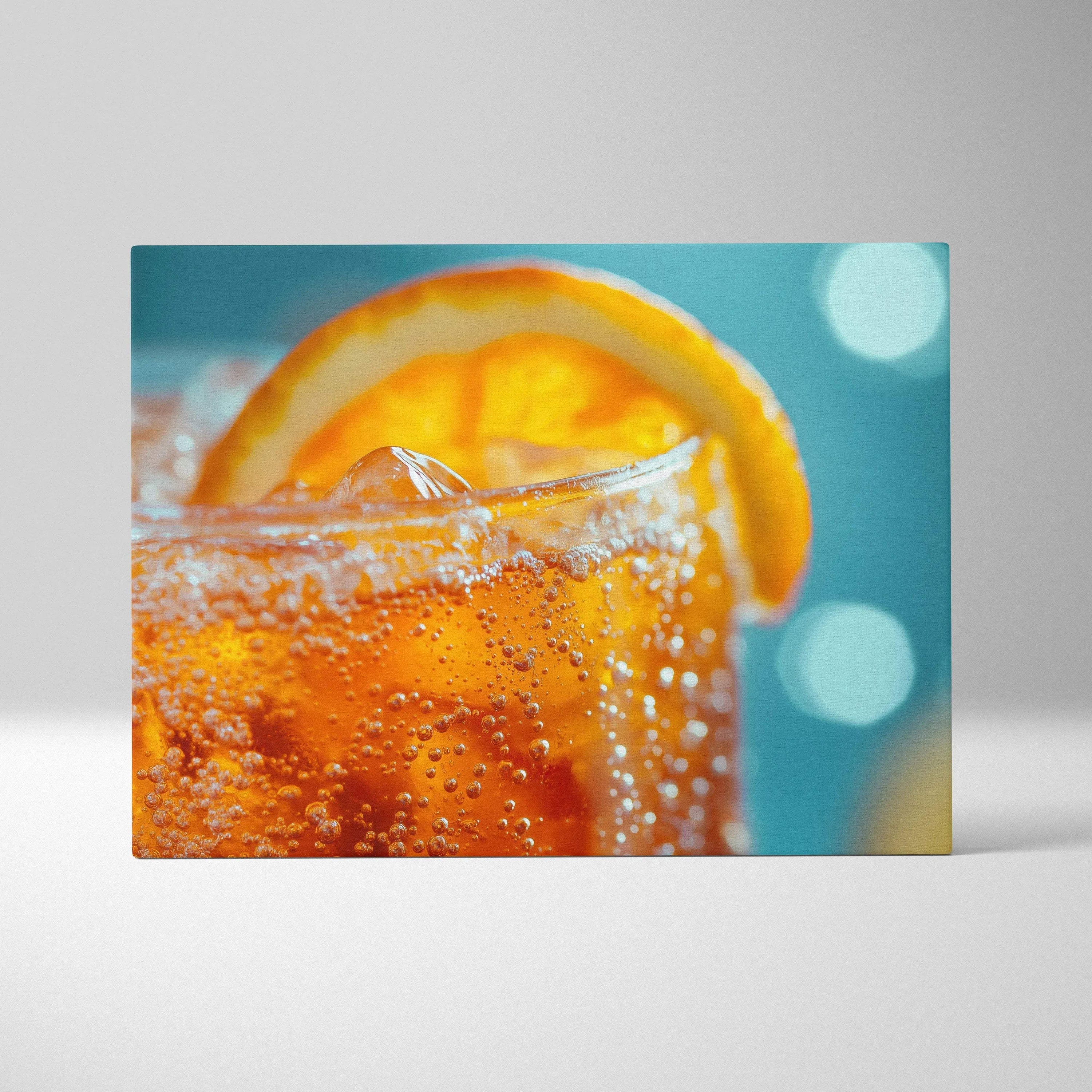 Bright orange drink with ice and an orange slice on bubbly liquid canvas wall art.