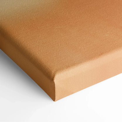 Close-up of vibrant orange canvas wall art with a smooth texture and neatly wrapped edges.