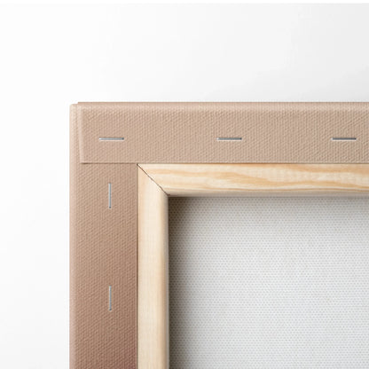 Close-up of wooden frame and beige canvas backing with visible staples on floral wall art canvas.