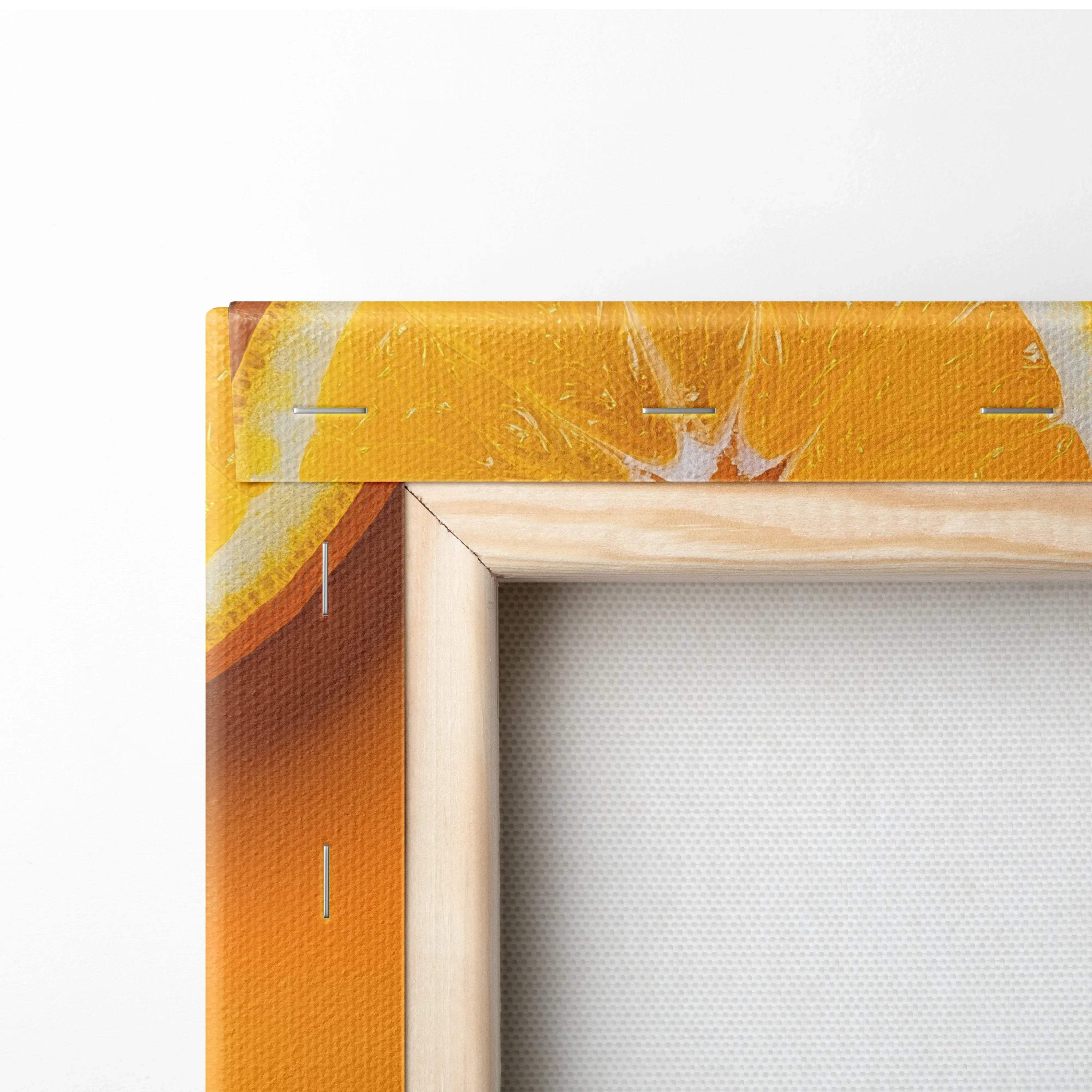 Close-up of vibrant orange slices canvas wall art with natural wood frame for home decor.