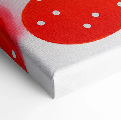 Red heart with white polka dots on textured canvas wall art corner for home and kitchen decor.